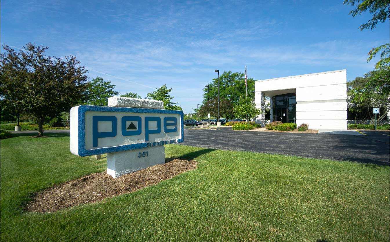 pope scientifics company sign outside of their building located in saukville wi